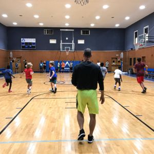 youth athletes warming up in a gym