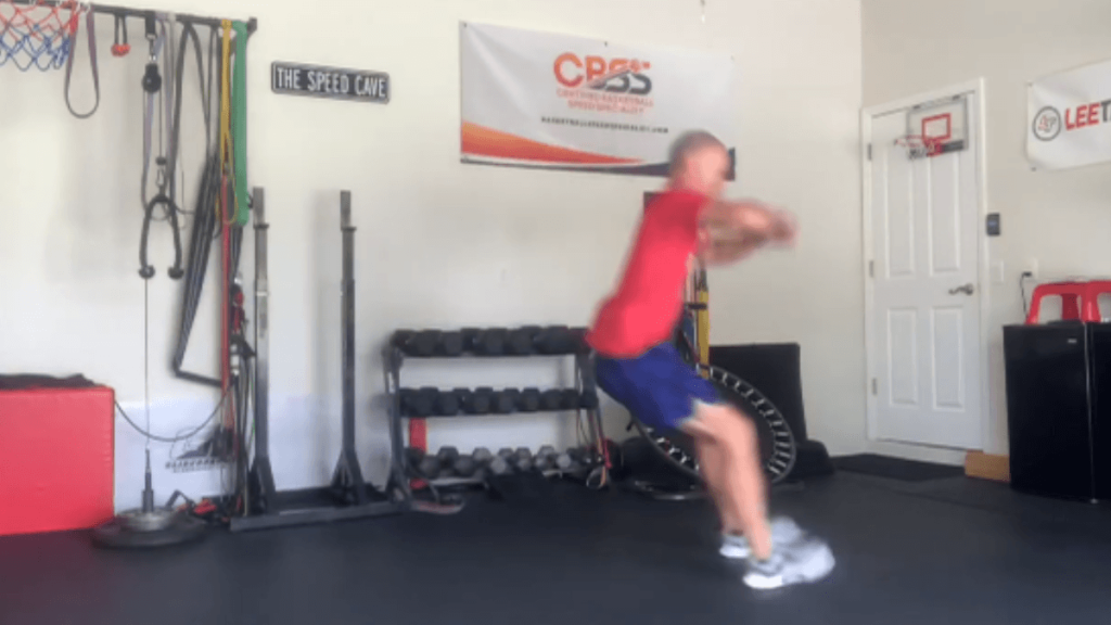 coach demonstrating landing on heels when jumping.